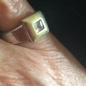 Two tone ring with set clear faceted stone